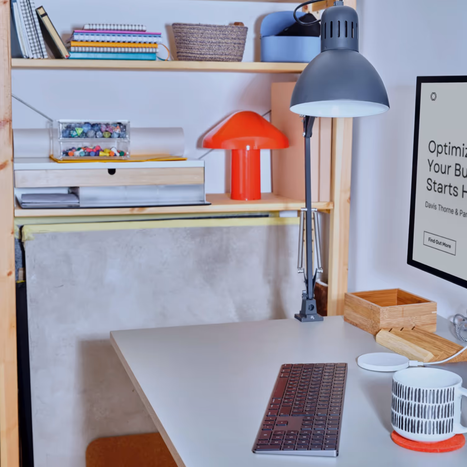 Meeting of a modern office workspace. The desk has a keyboard and modern display on it.