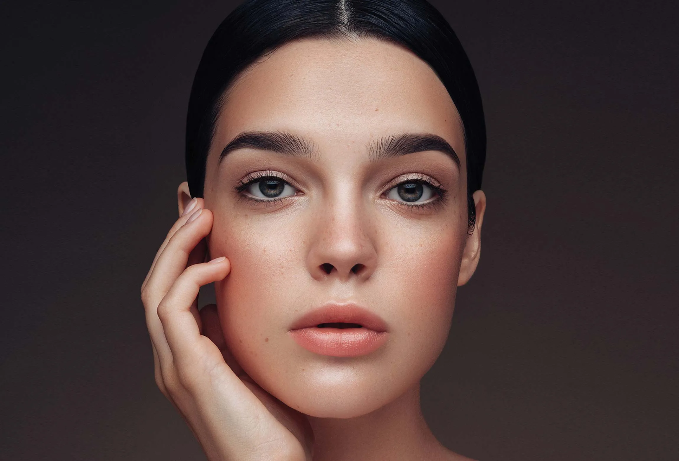 An editorial style photo of a woman with naturally looking permanent make-up.