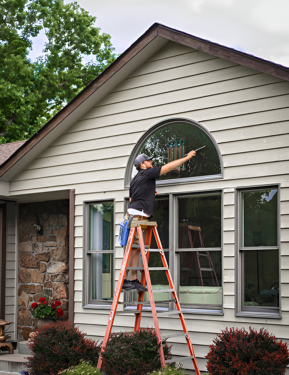 man working on windows cleaning services