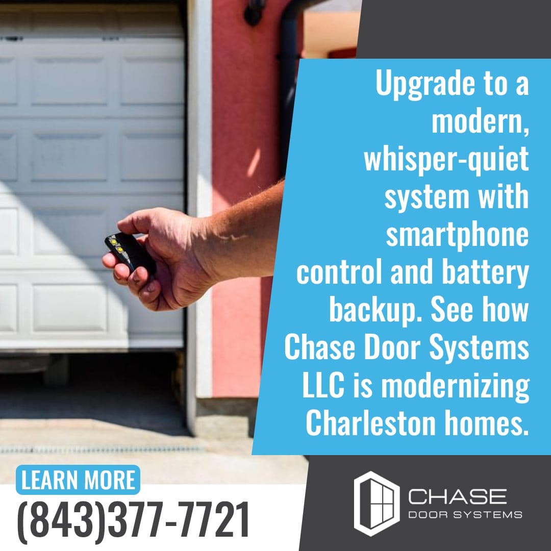 Hand using garage door remote with modern smart opener system for quiet and convenient home access.