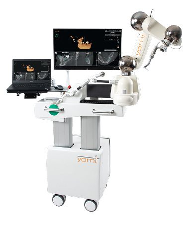 Yomi robotic dental system with adjustable arm and dual monitors displaying 3D jaw and dental implant planning software.