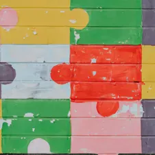 brick wall painted into puzzle pieces