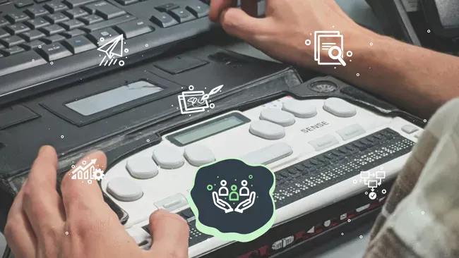 person using braille display with laptop