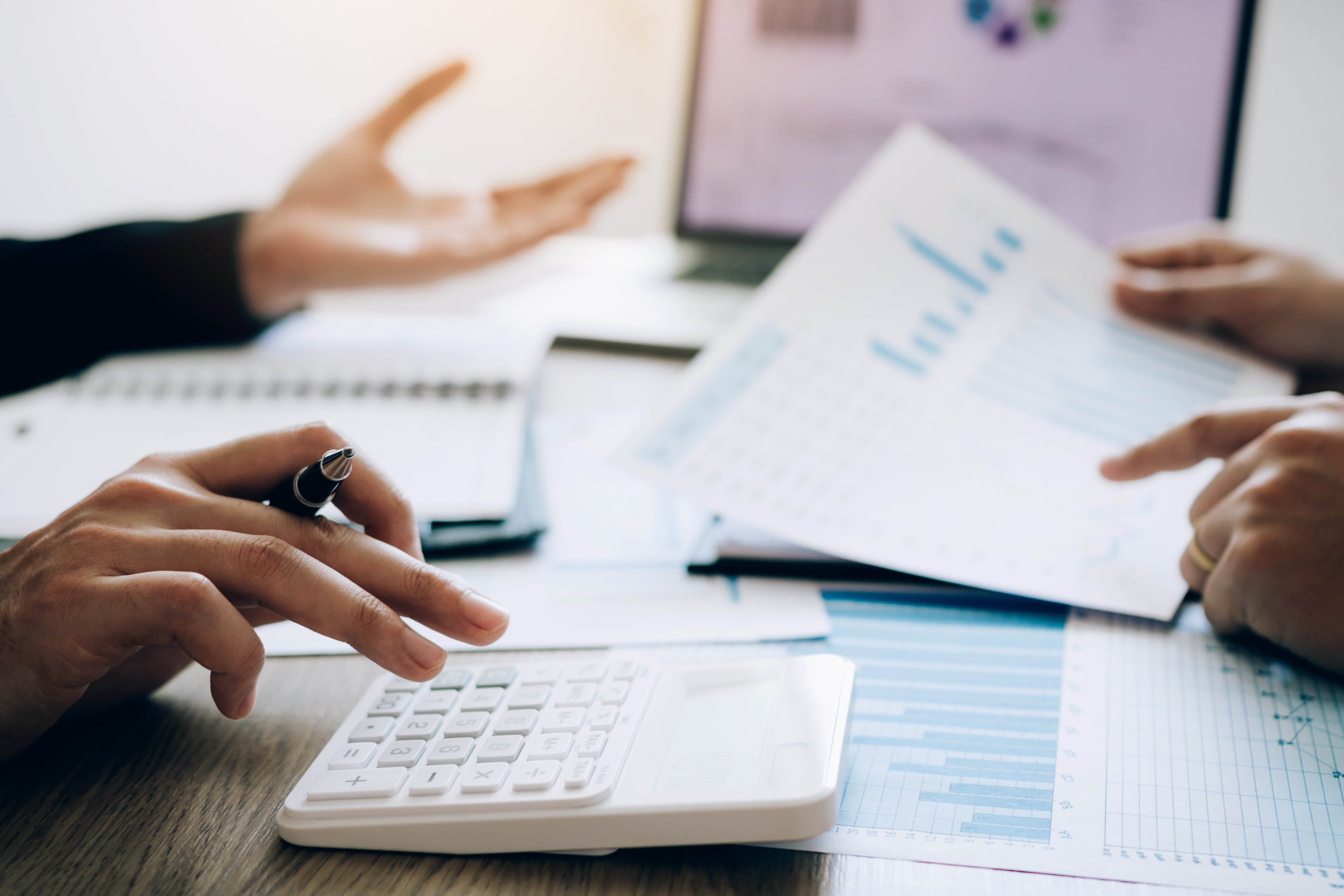 Business professional reviewing financial documents highlighting efficient debt collection strategies