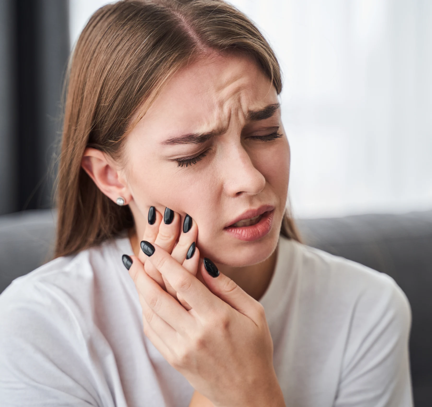 A woman with tooth pain