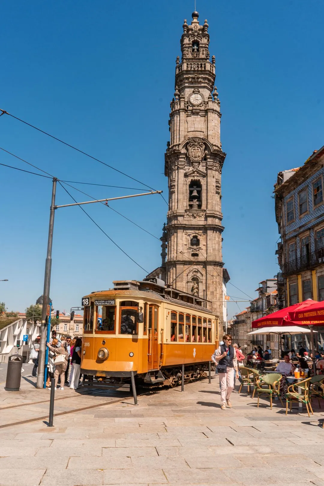 Image of a tram and a tower in Porto.