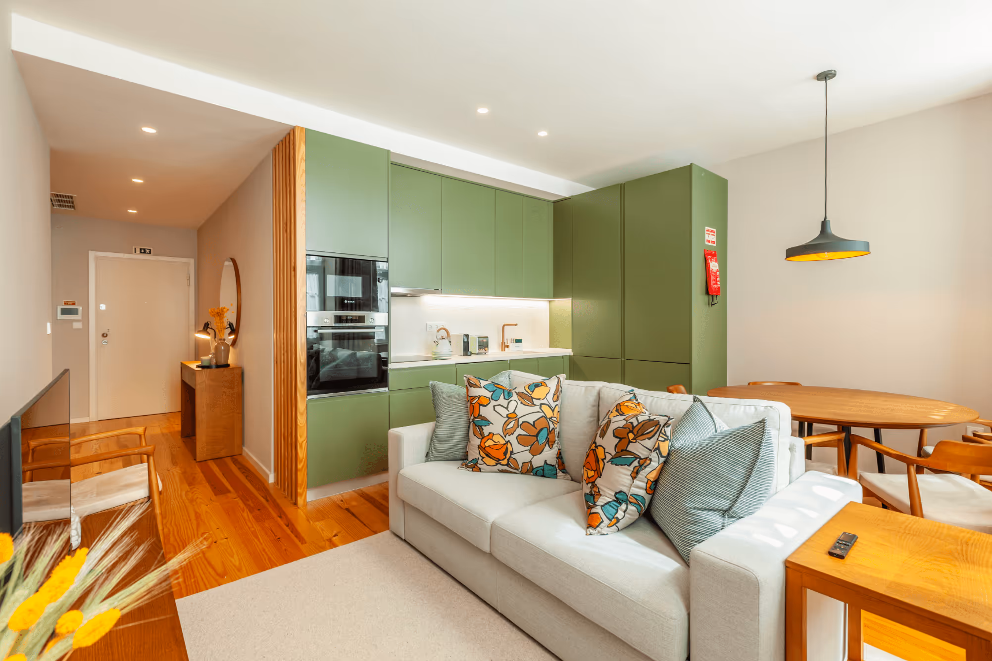 Small house with a green kitchen.