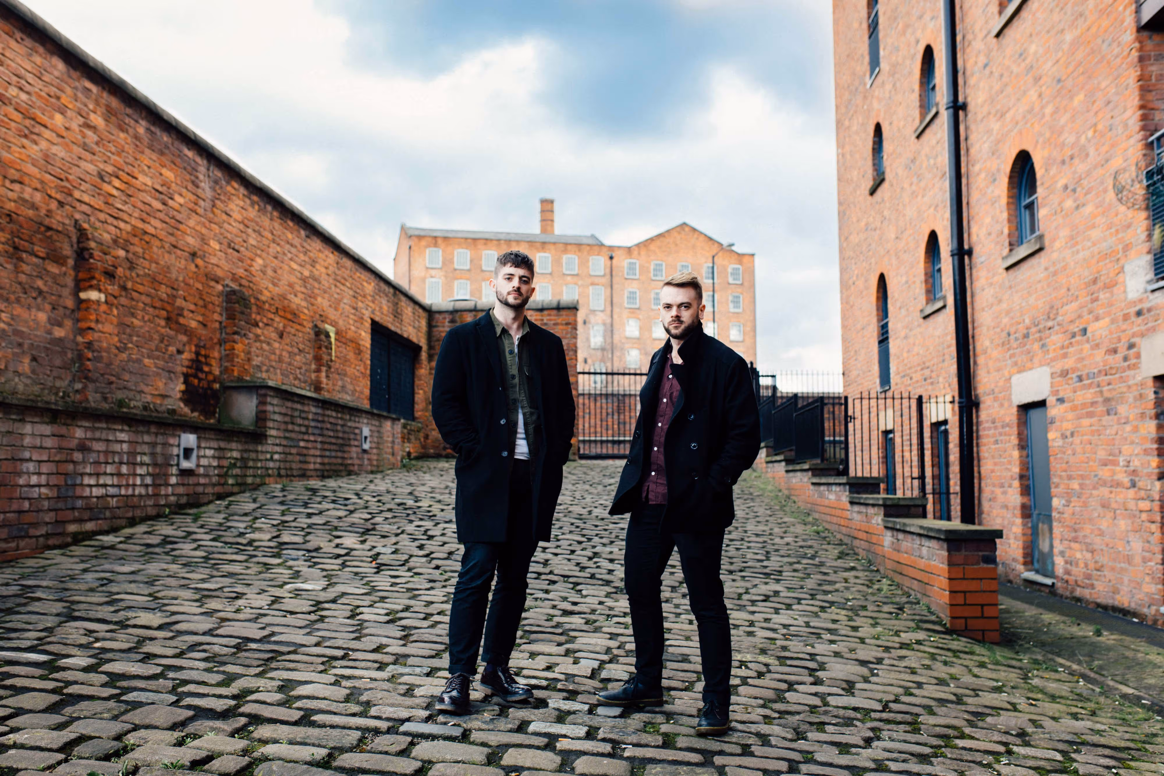band members standing on cobbled street in northern quarter