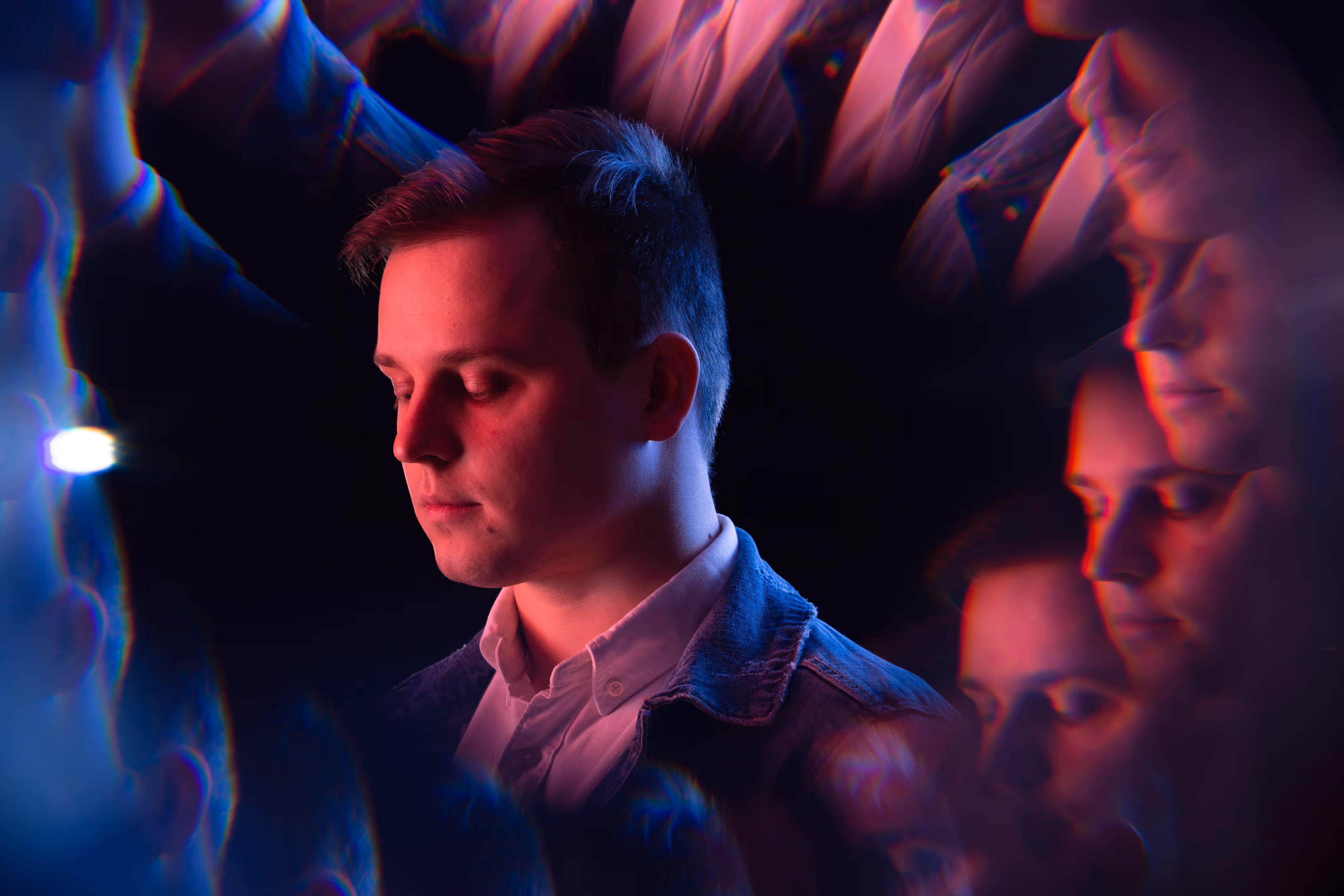 electronic producer appears in trippy promotional studio shoot