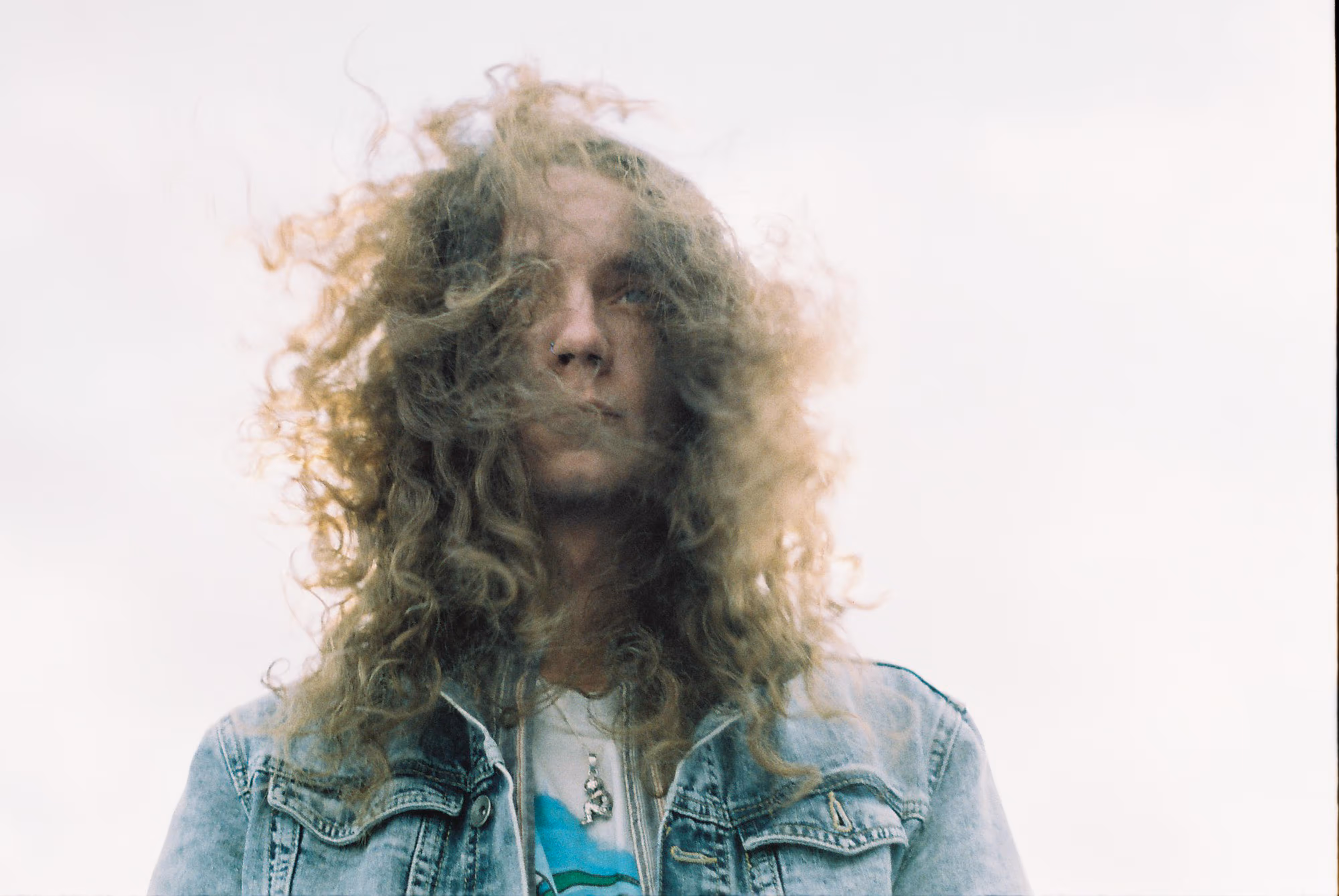 photo of a musician looking down taken on film