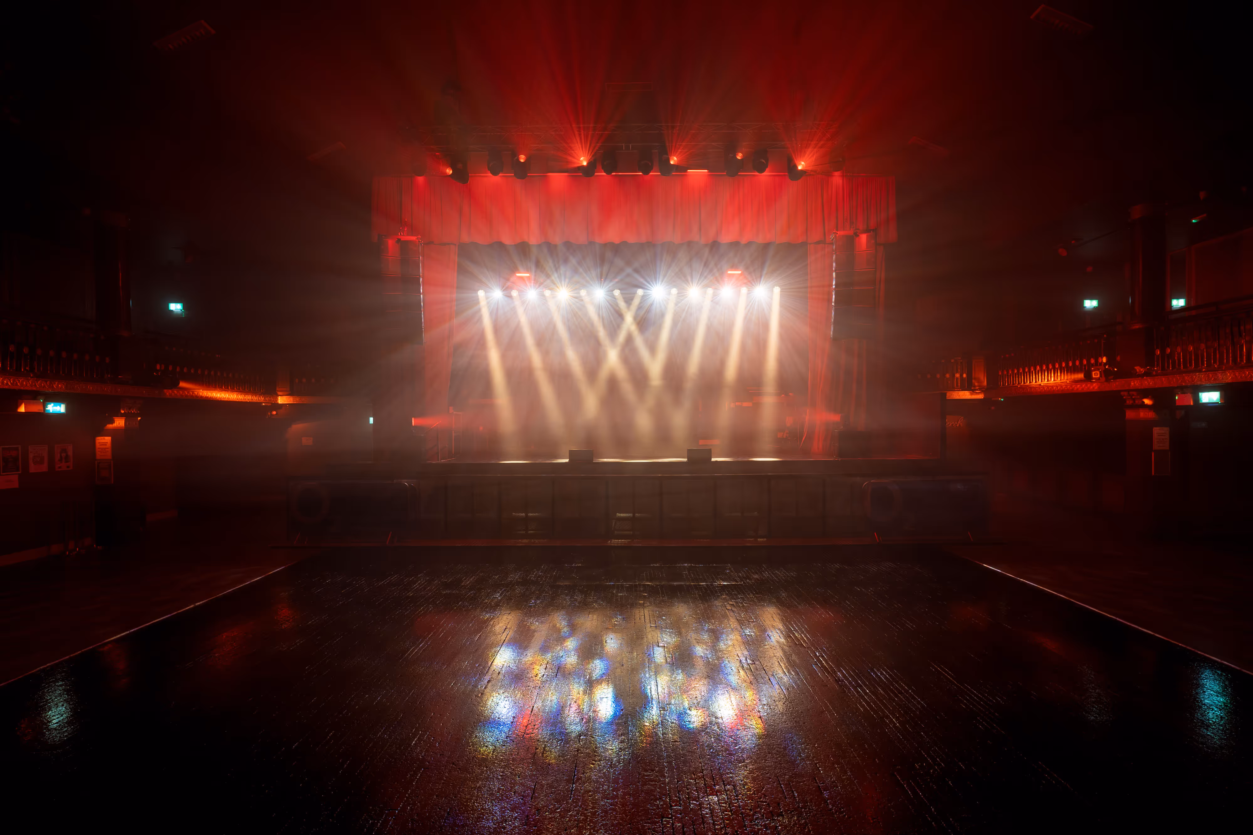 The stage of music venue Mancehster Ritz with lights on.