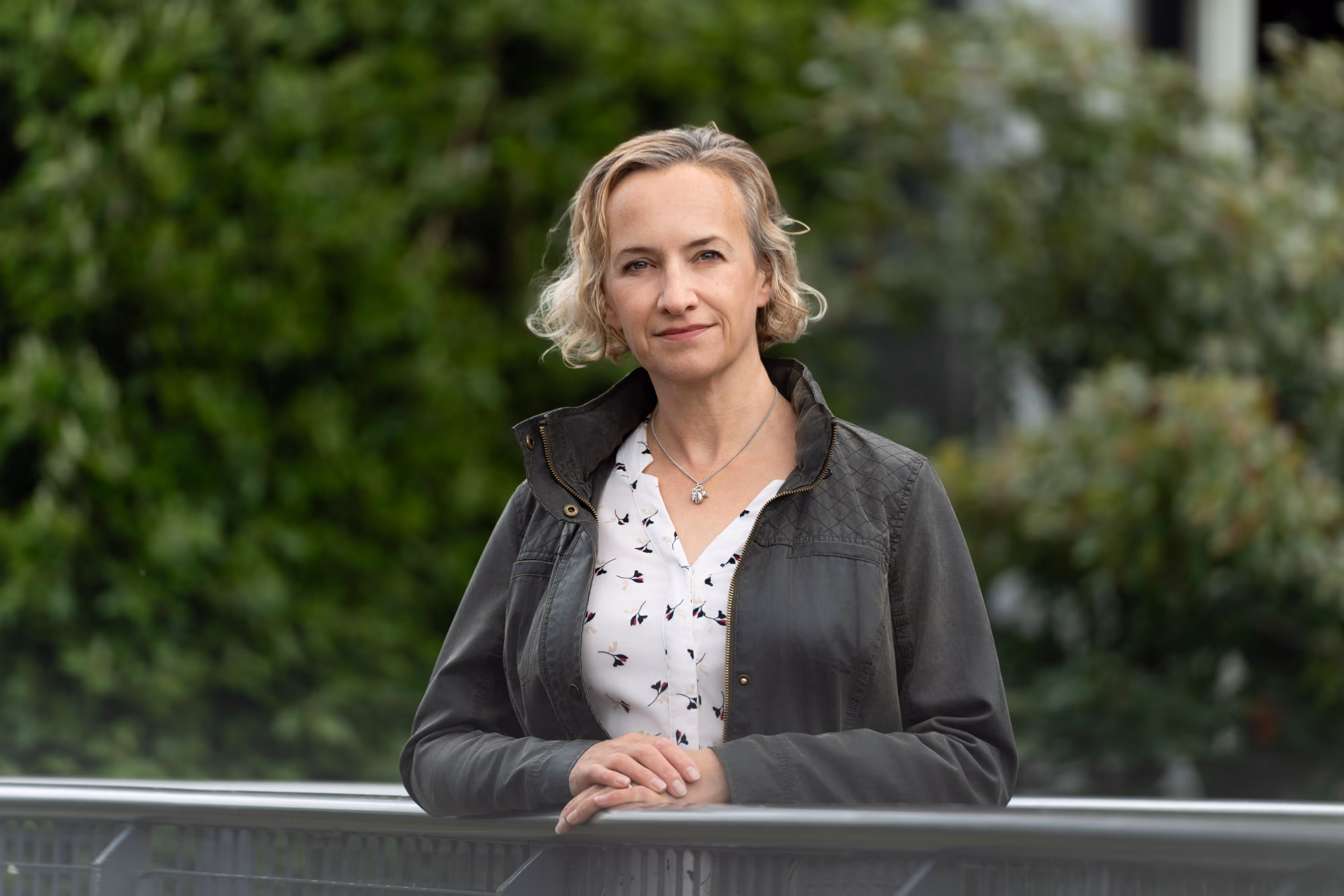 An outdoor business portrait taken in Manchester's NQ on a pedestrian bridge over the Rochdale canal.
