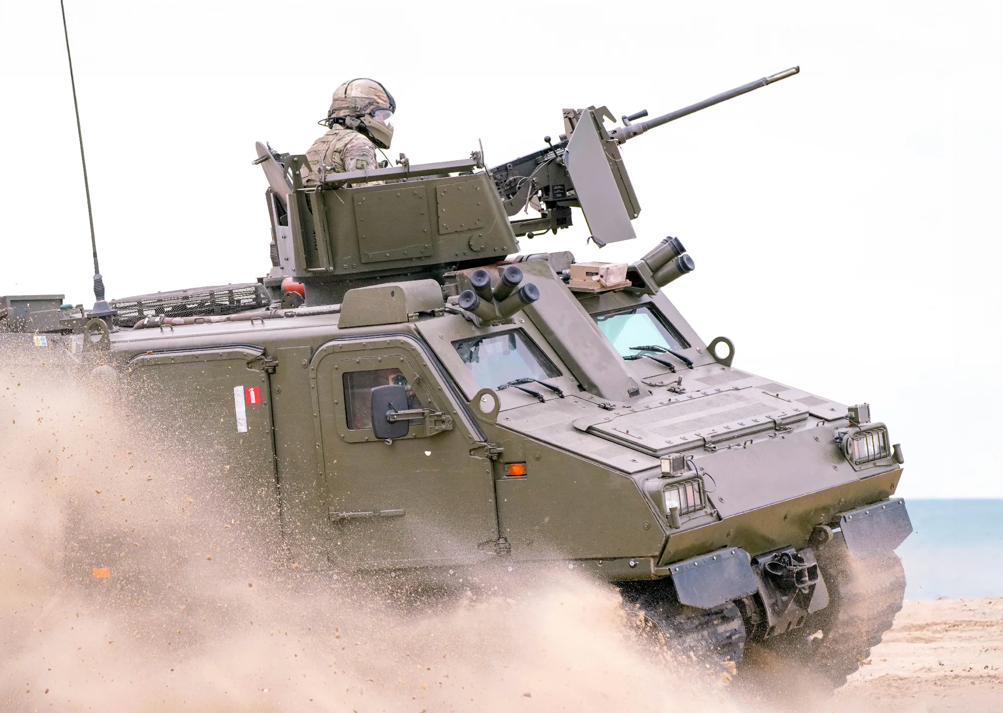 a military vehicle with a gun on top