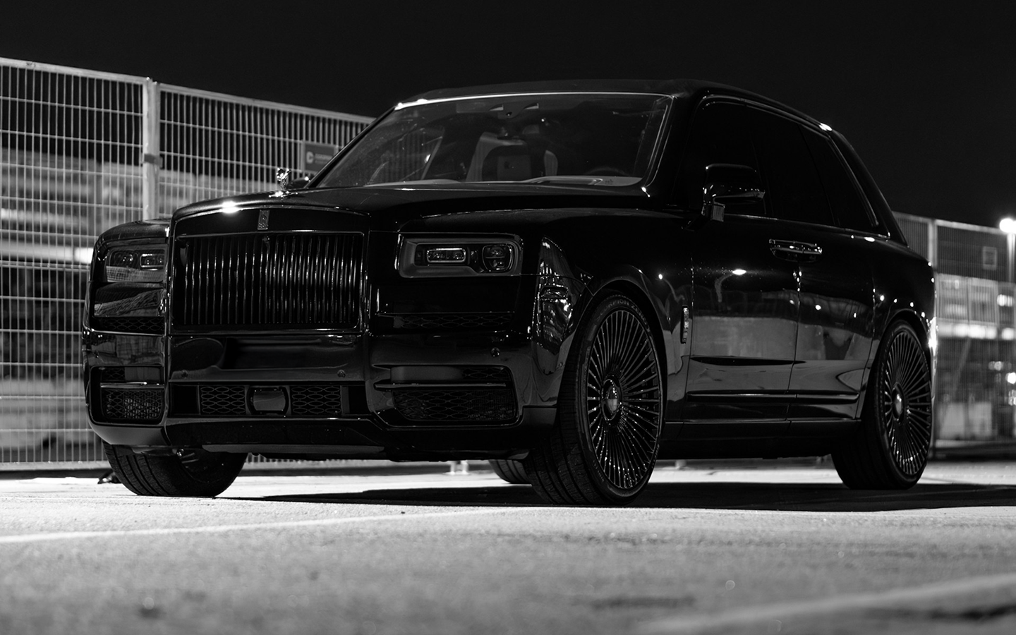 a black car parked in a parking lot
