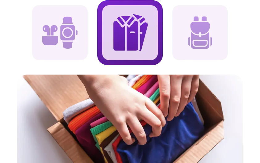 Hands organizing colorful shirts in a box, representing apparel and product fulfillment.