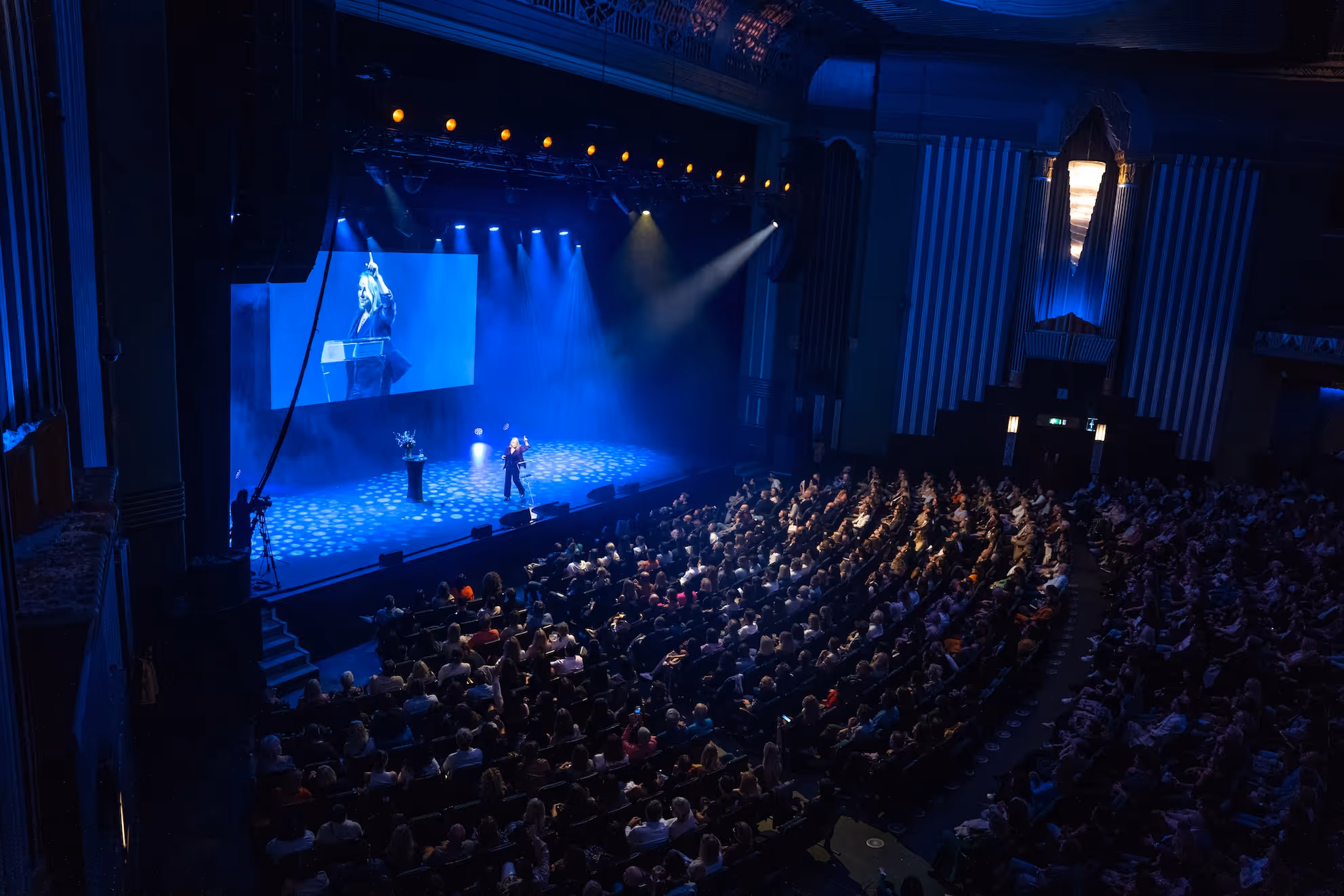 Esther Perel Speaks to audience in a theatre