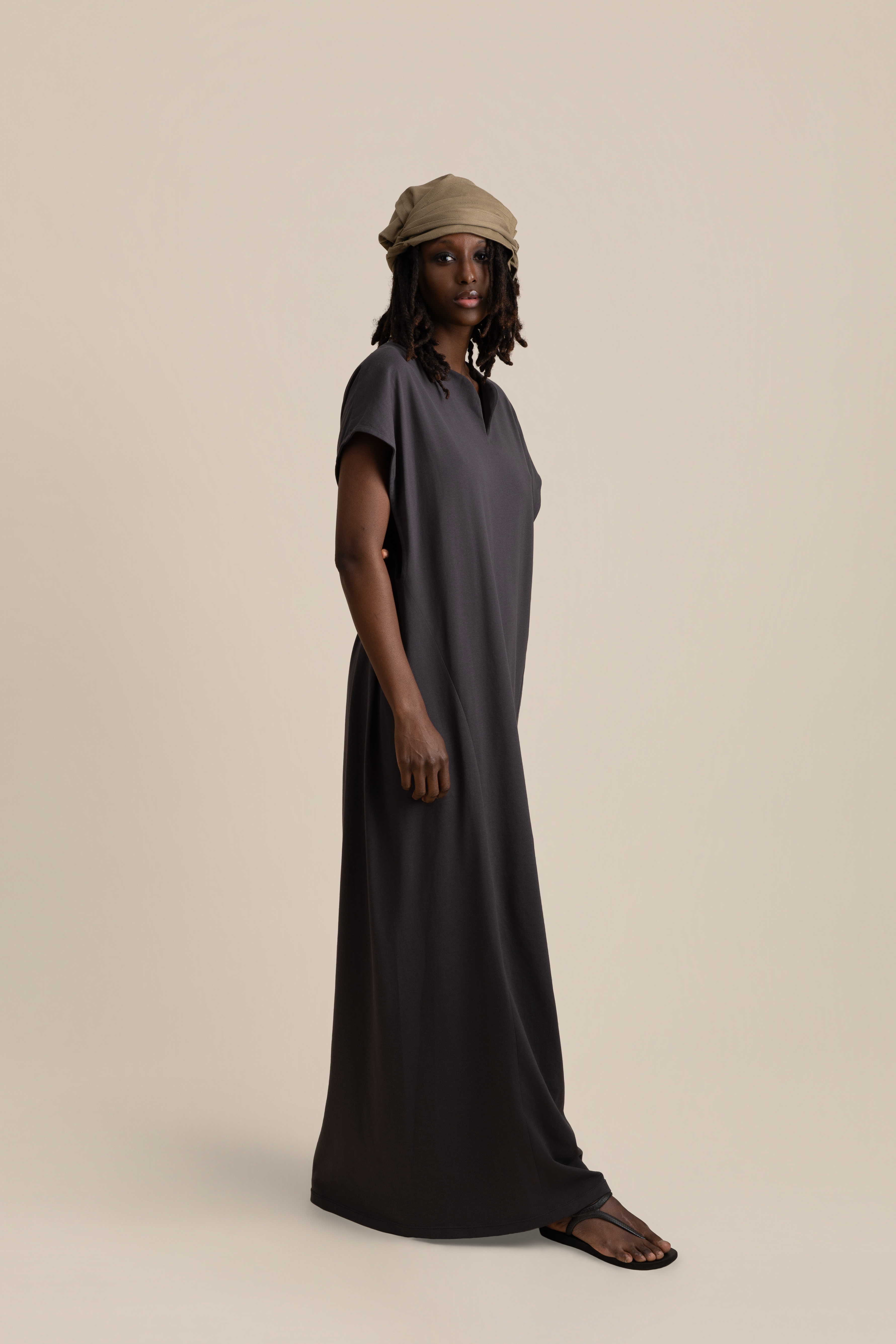 Model wearing white U-neck tunic in soft cream light, Oniri editorial aesthetic