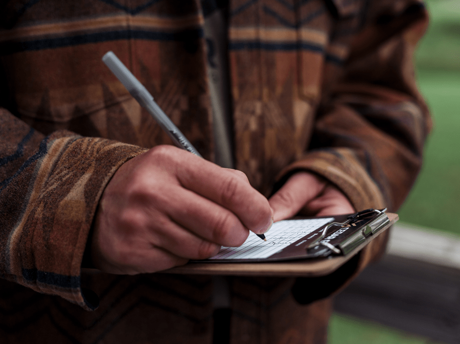 a Cedar Gate team member taking notes