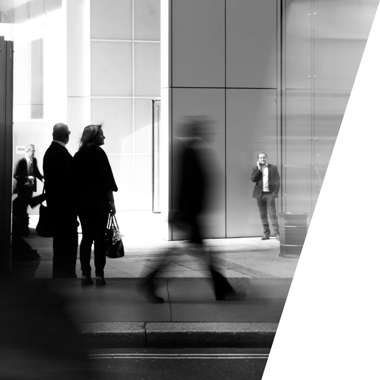 a group of people standing outside of a building