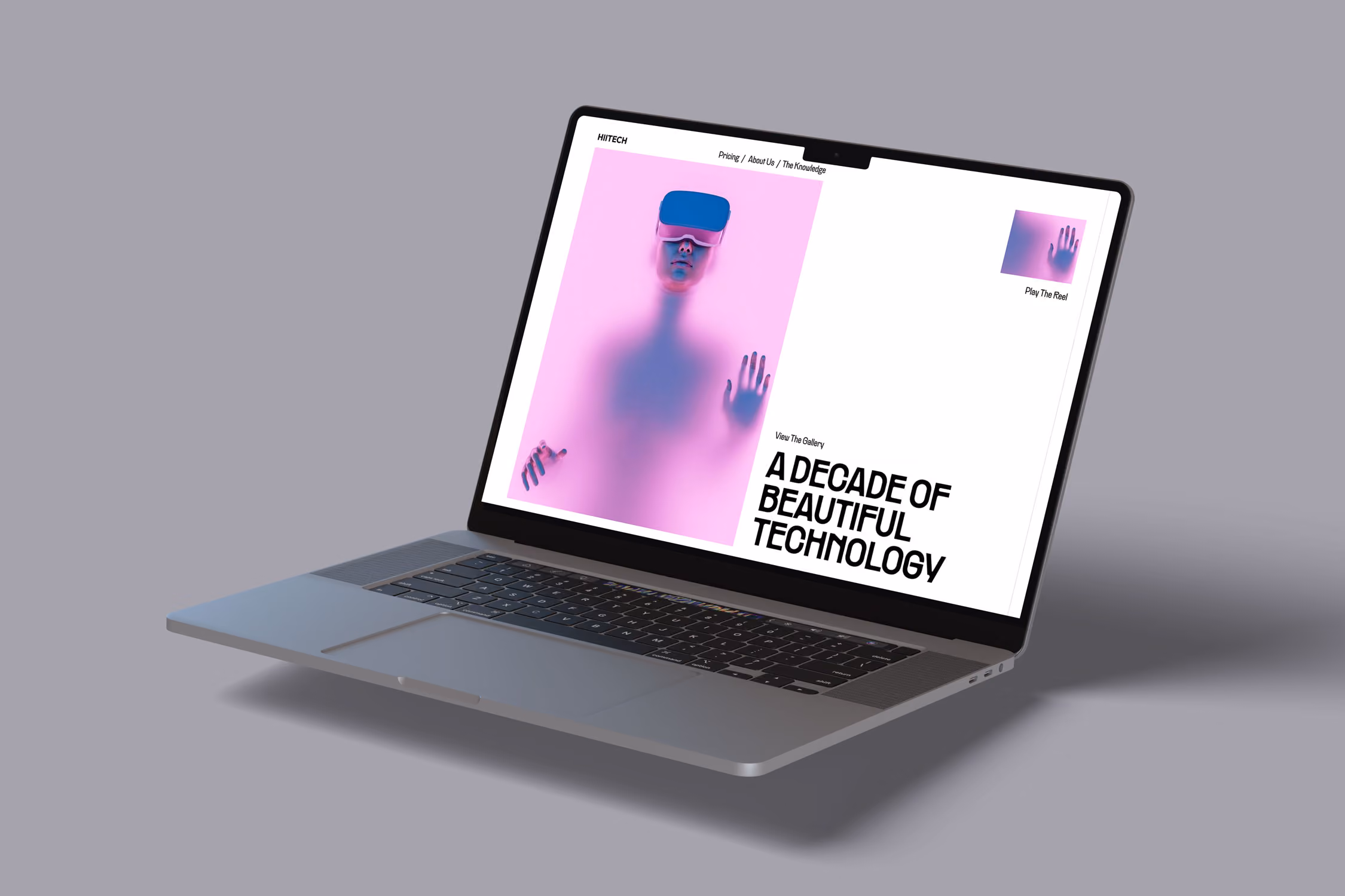 Laptop displaying a website with a purple image of a person wearing VR goggles and text about beautiful technology.