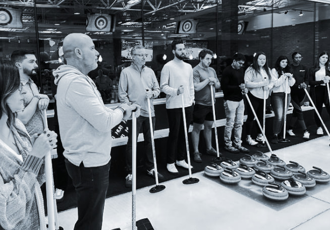 C2 Private Wealth team playing curling