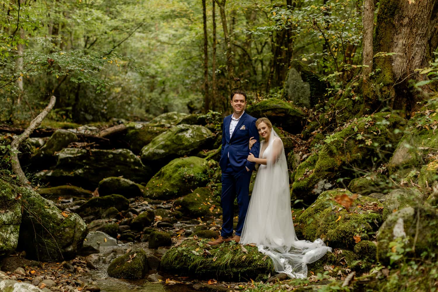 A bride and groom at Elly's Mill in Gatlinburg, Tennessee