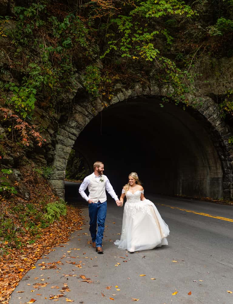 Elopement couple portrait photo at Cades Cove tunnel vertical