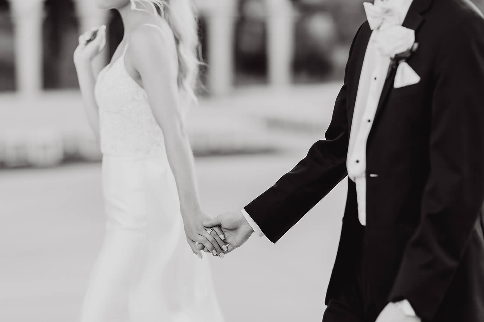 Wedding photo of couple holding hands