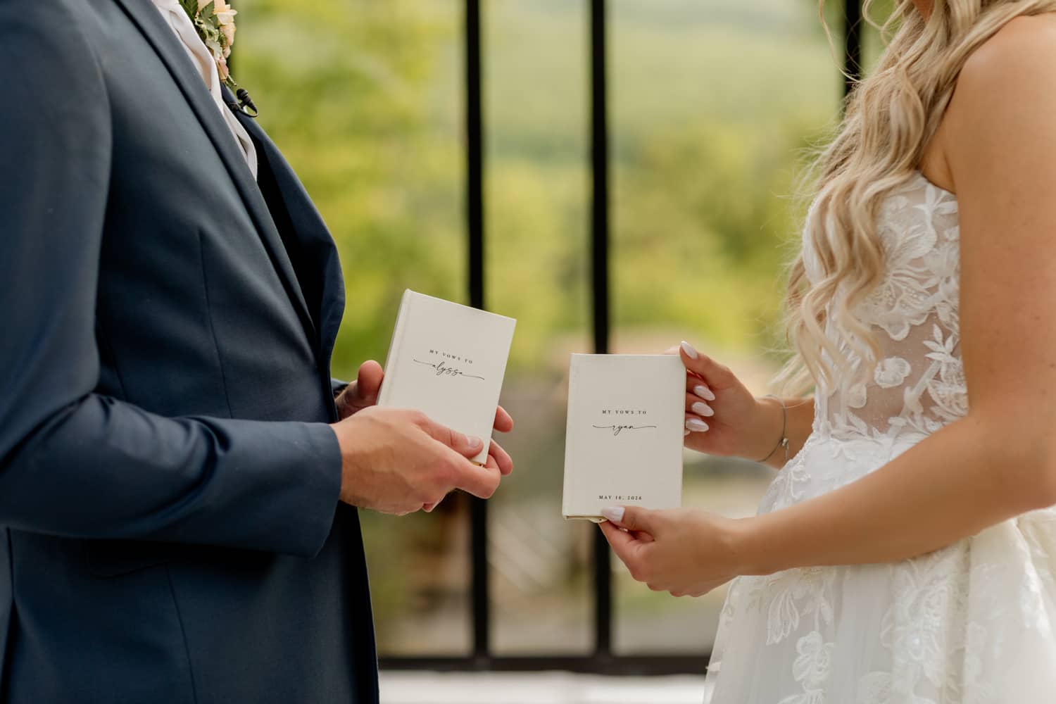 A couple holds wedding vows, standing together with a scenic backdrop of the Smoky Mountains.