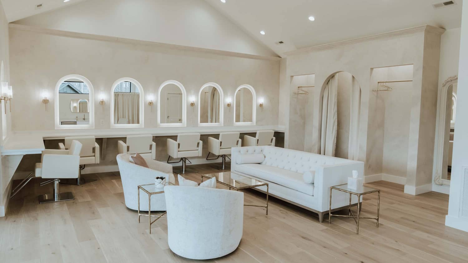 Bright, modern, bridal suite interior with white furniture and elegant decor, ideal for elopements in the Smoky Mountains.