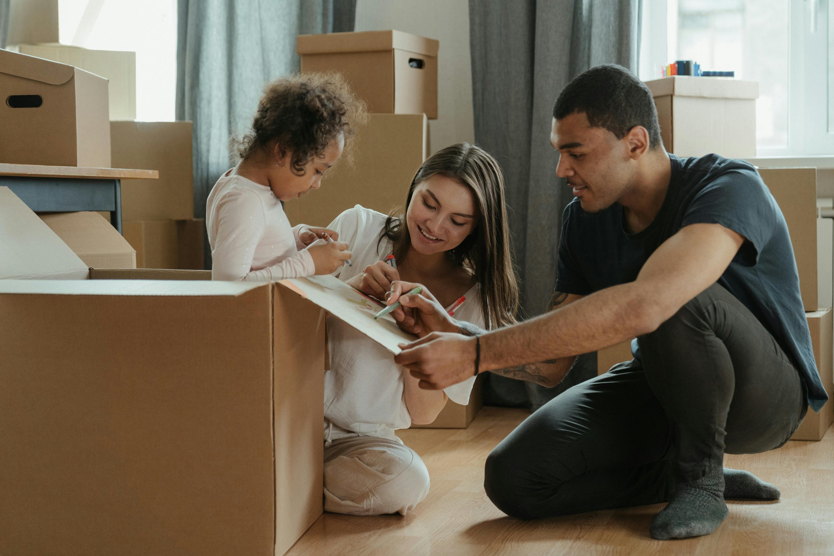 A young family packing for a move.