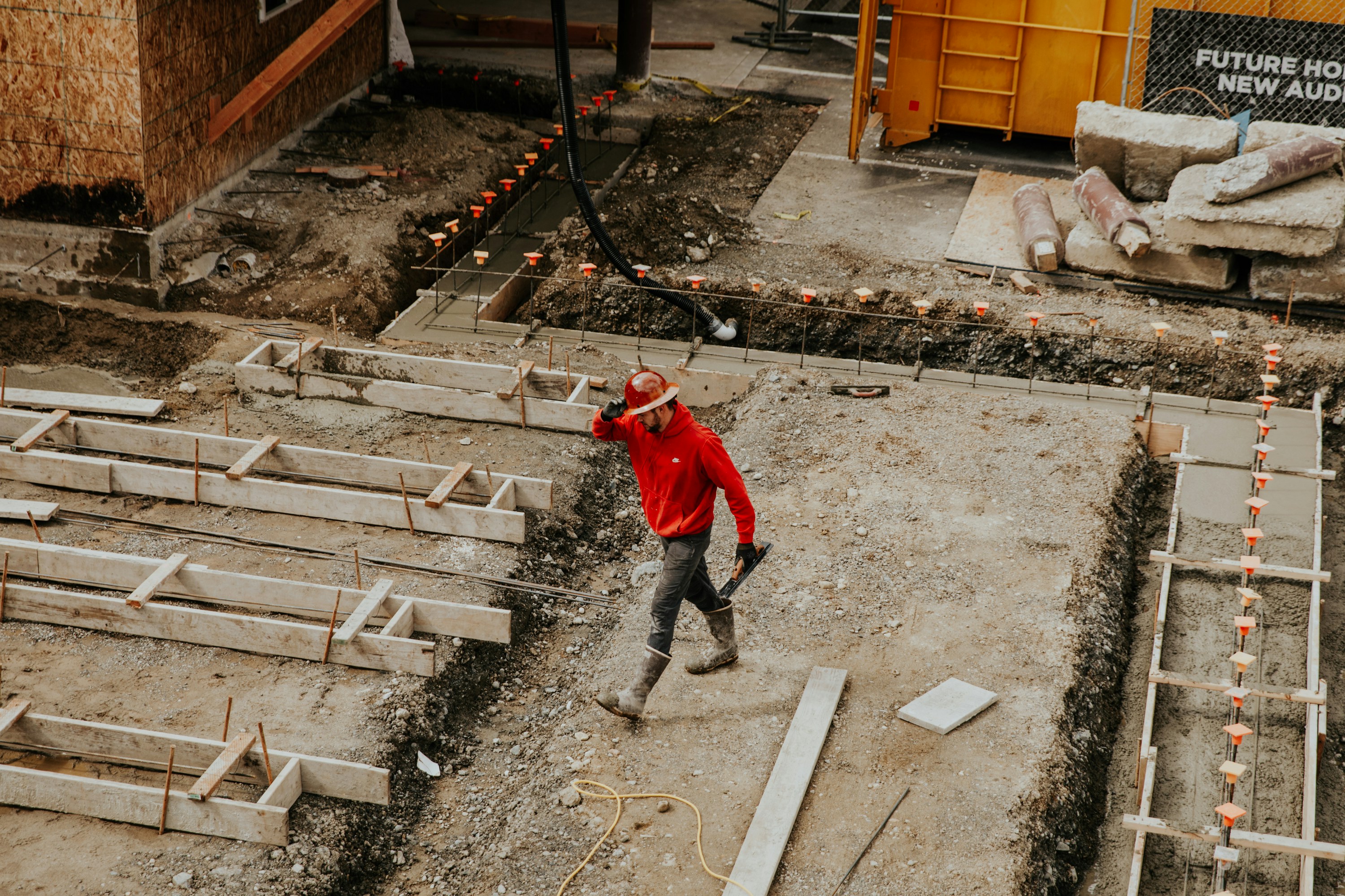 A man walking on a construction site.