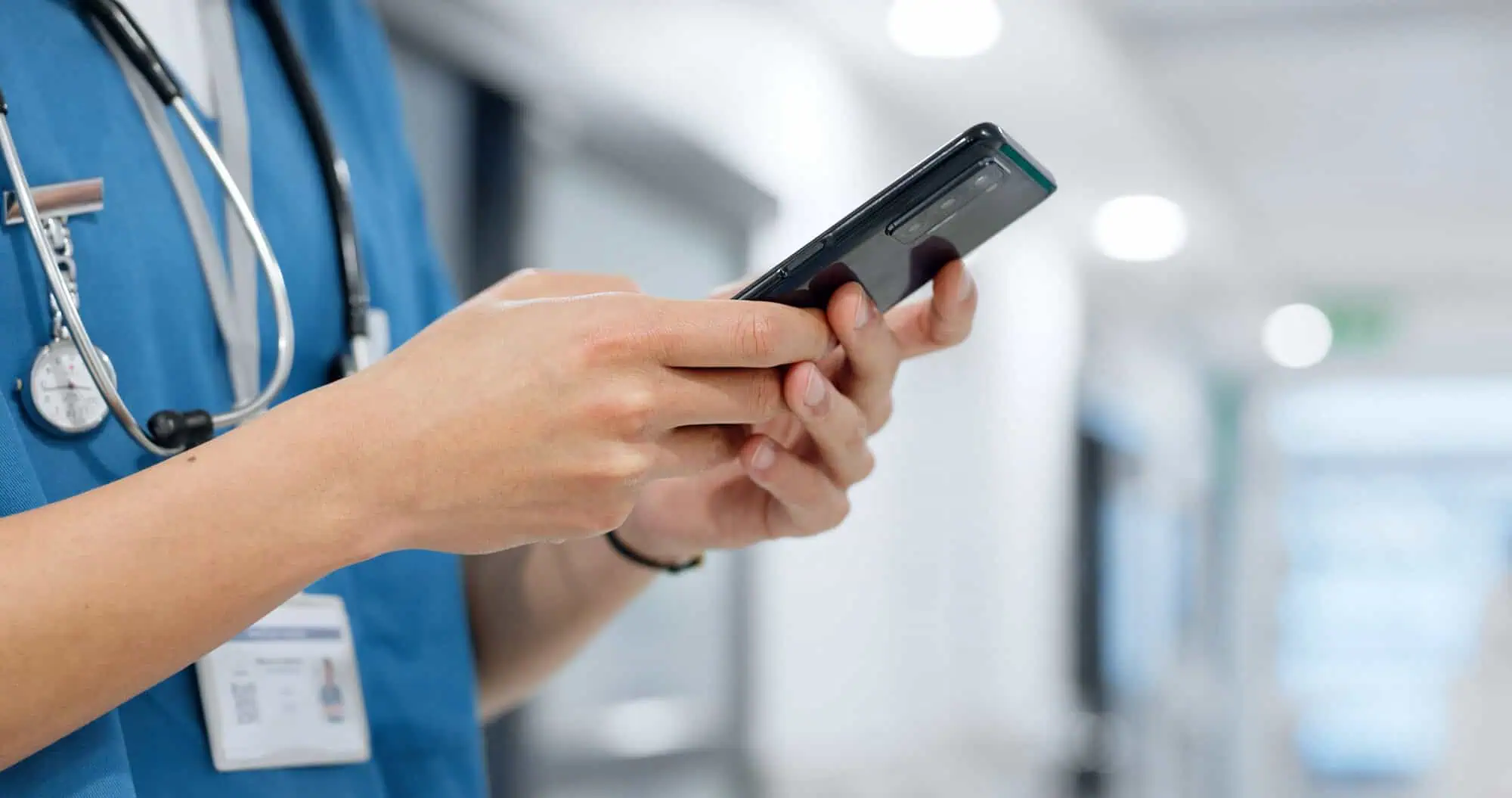 close up of nurse holding phone