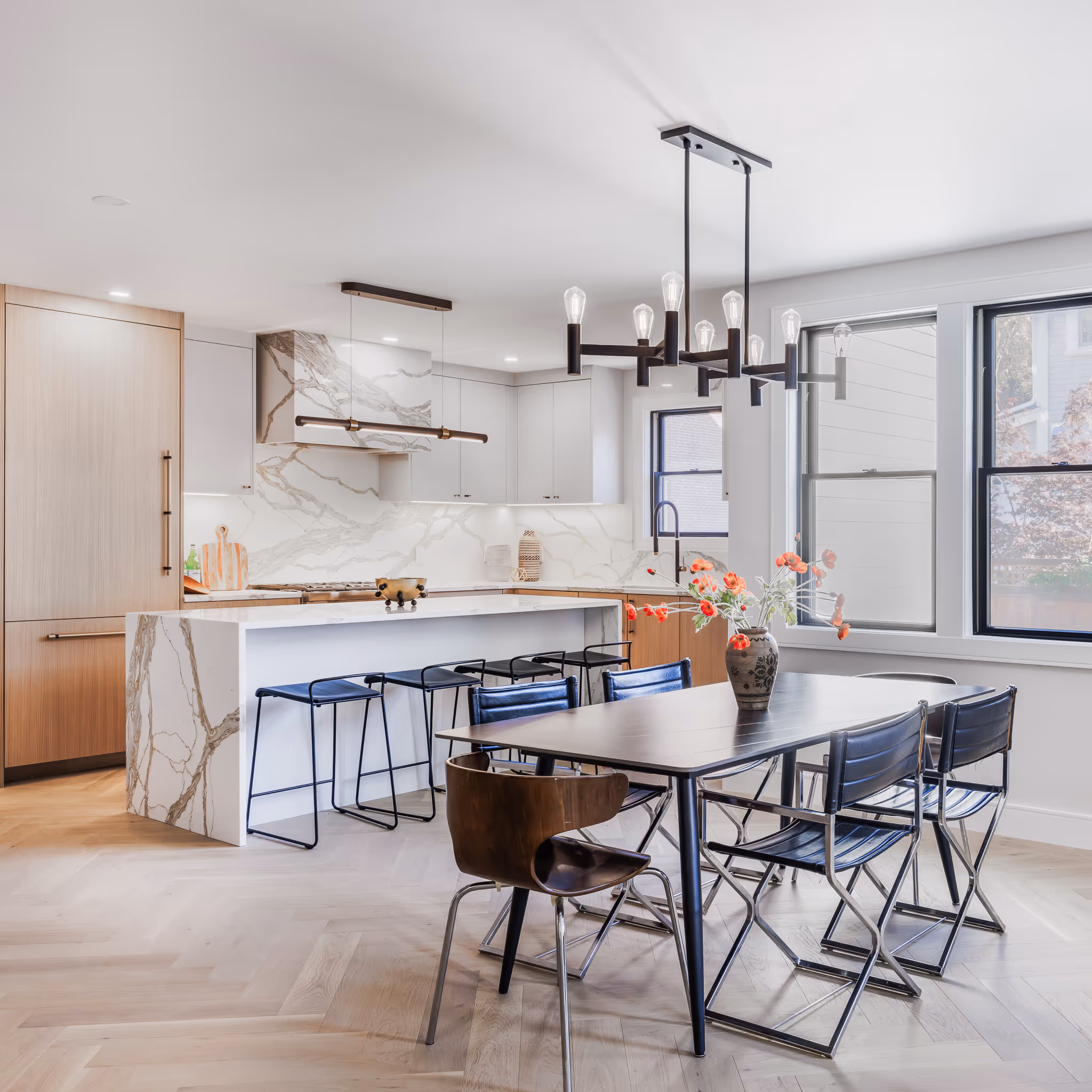 Spacious modern kitchen with natural light and dining area – Boston real estate