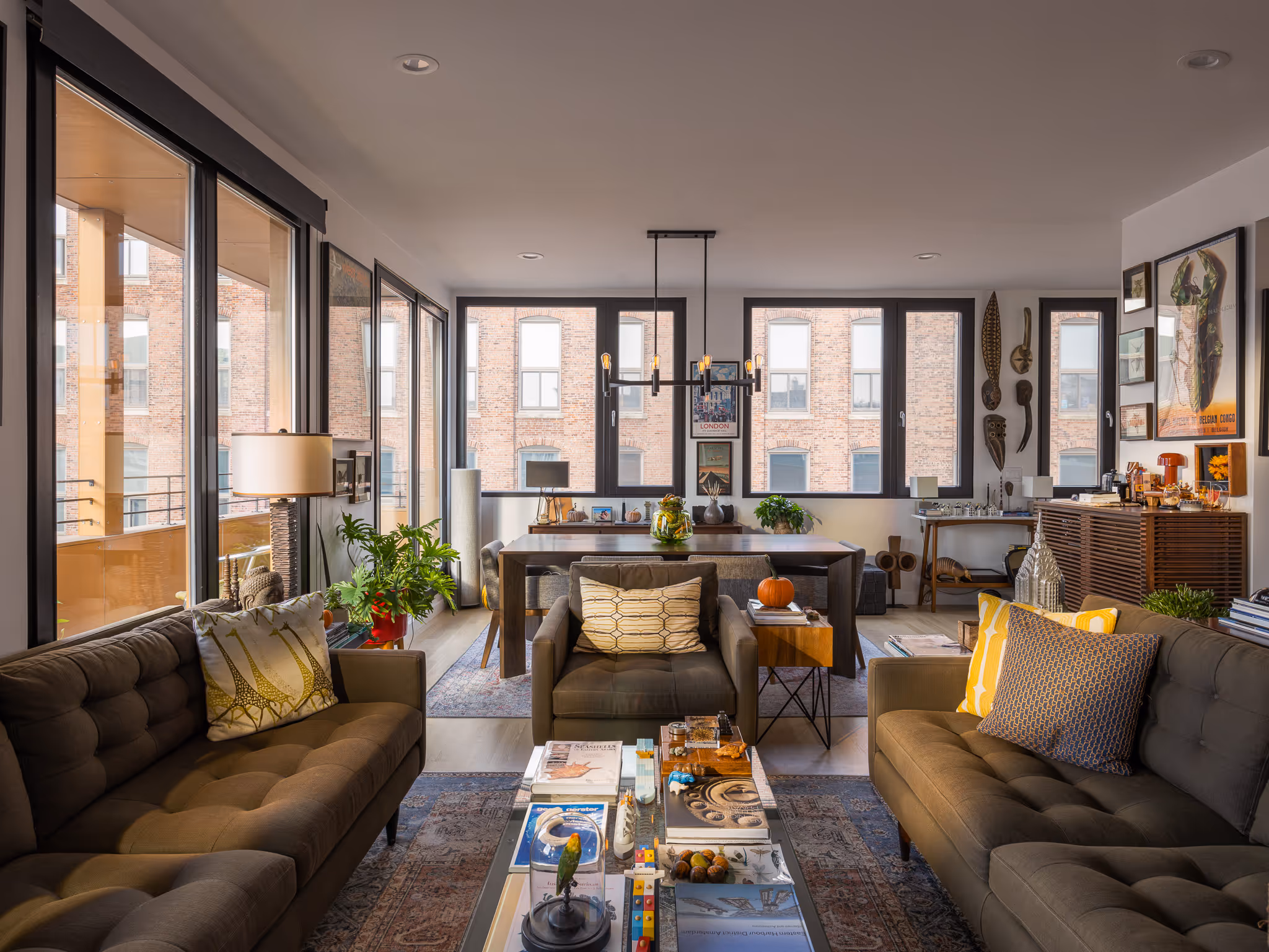 Modern apartment living area with city view and neutral tones.