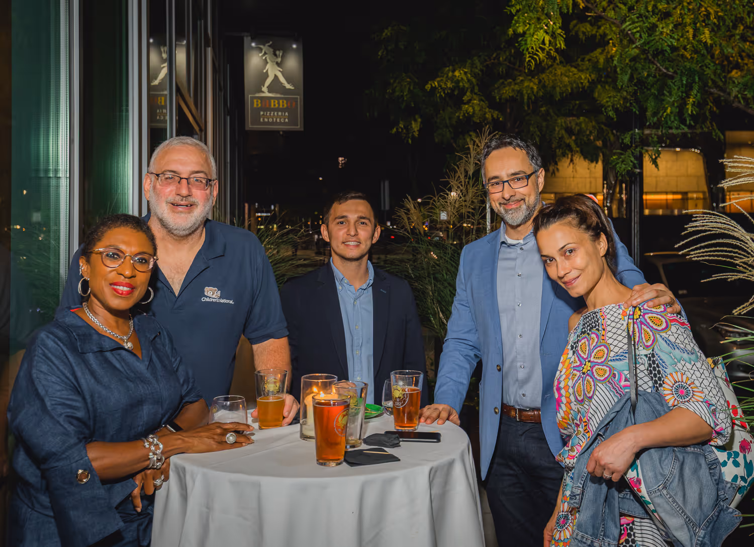 Small group dining and smiling at a Boston event captured by local event photographer.