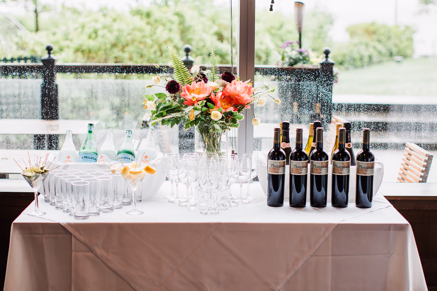 Event table setup with champagne and flowers captured by Boston event photographer.