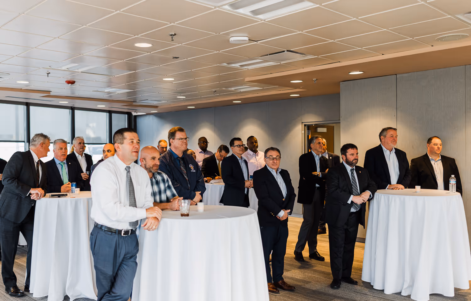Professionals networking during a cocktail hour photographed by Boston event photographer.