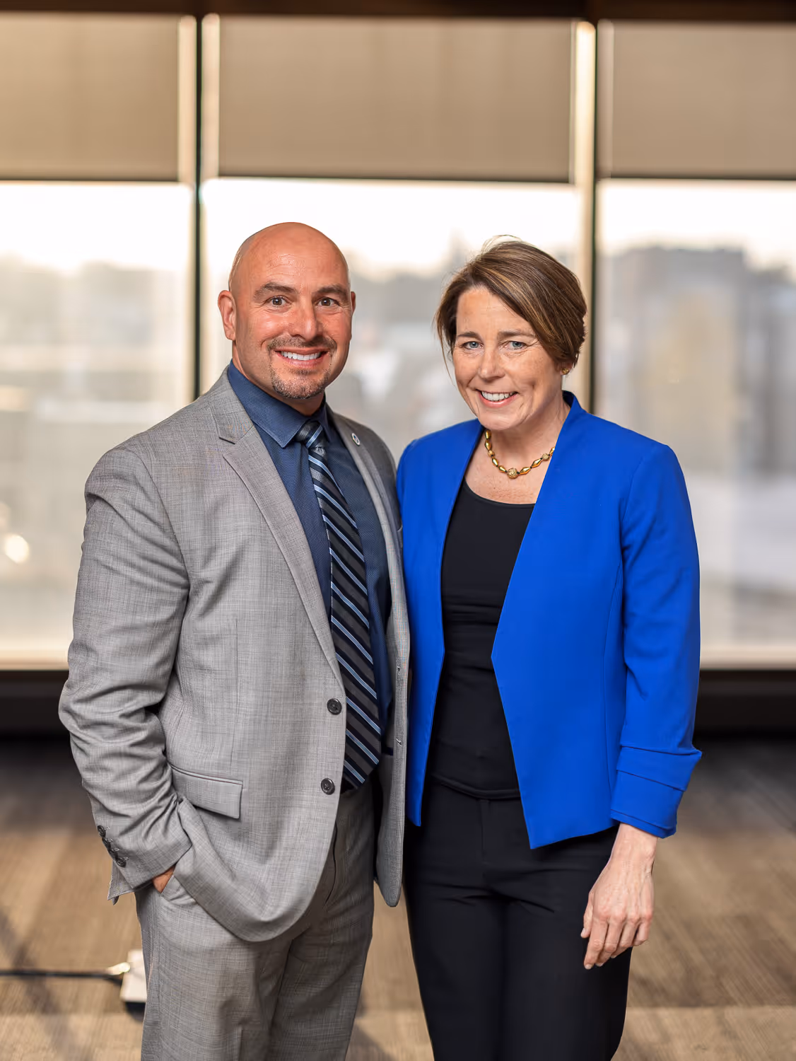 wo professionals posing together at a Boston event photographed by Boston event photographer.