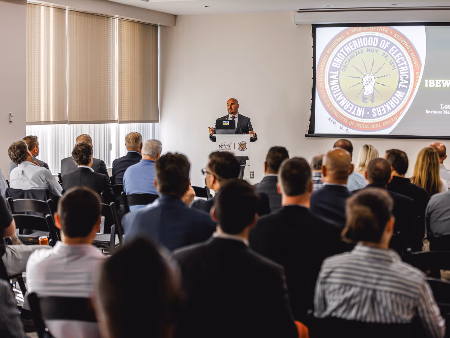 Speaker presenting in a Boston business meeting captured by Boston event photographer.