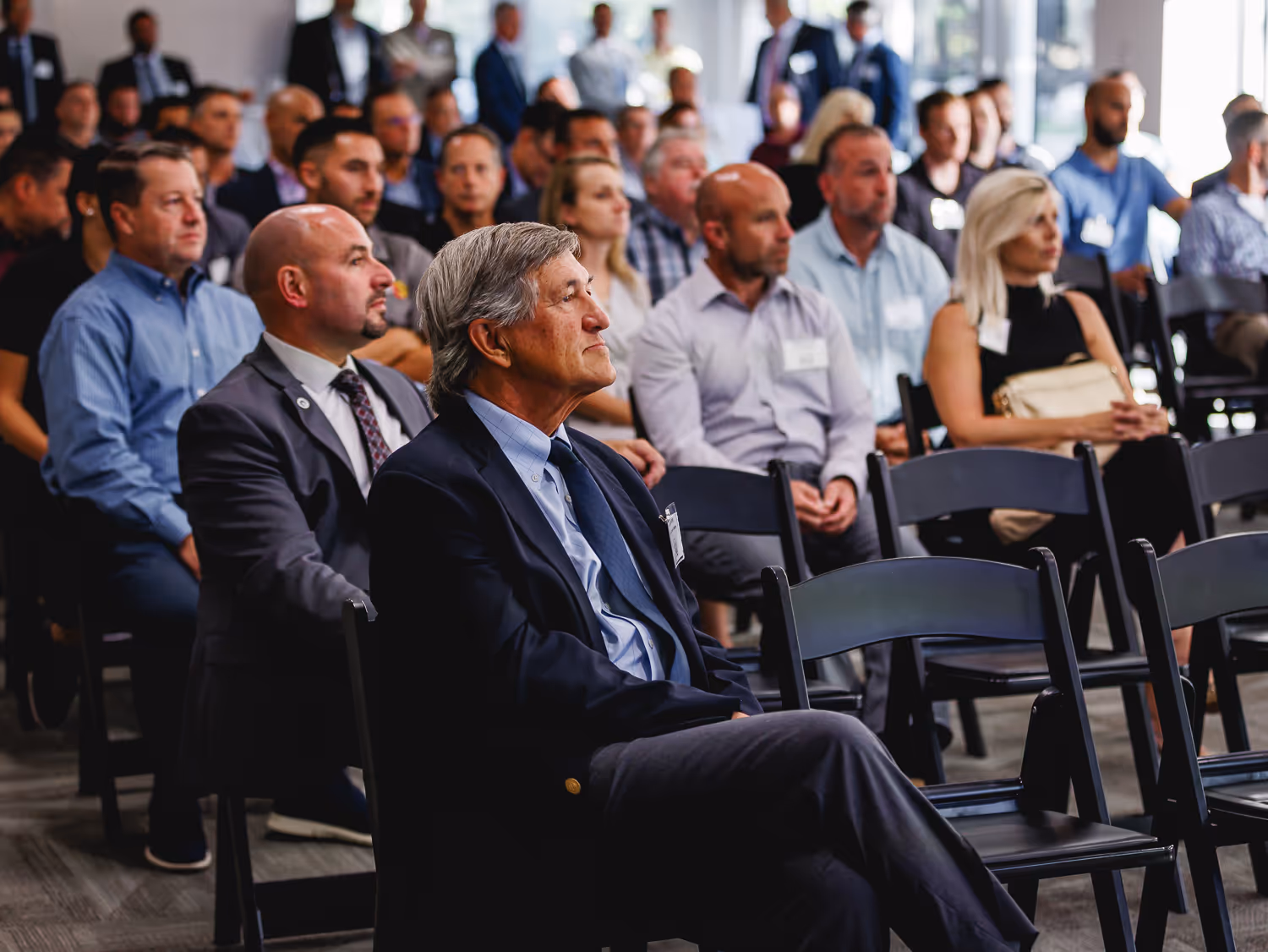 Audience listening during a Boston corporate seminar photographed by Boston event photographer.