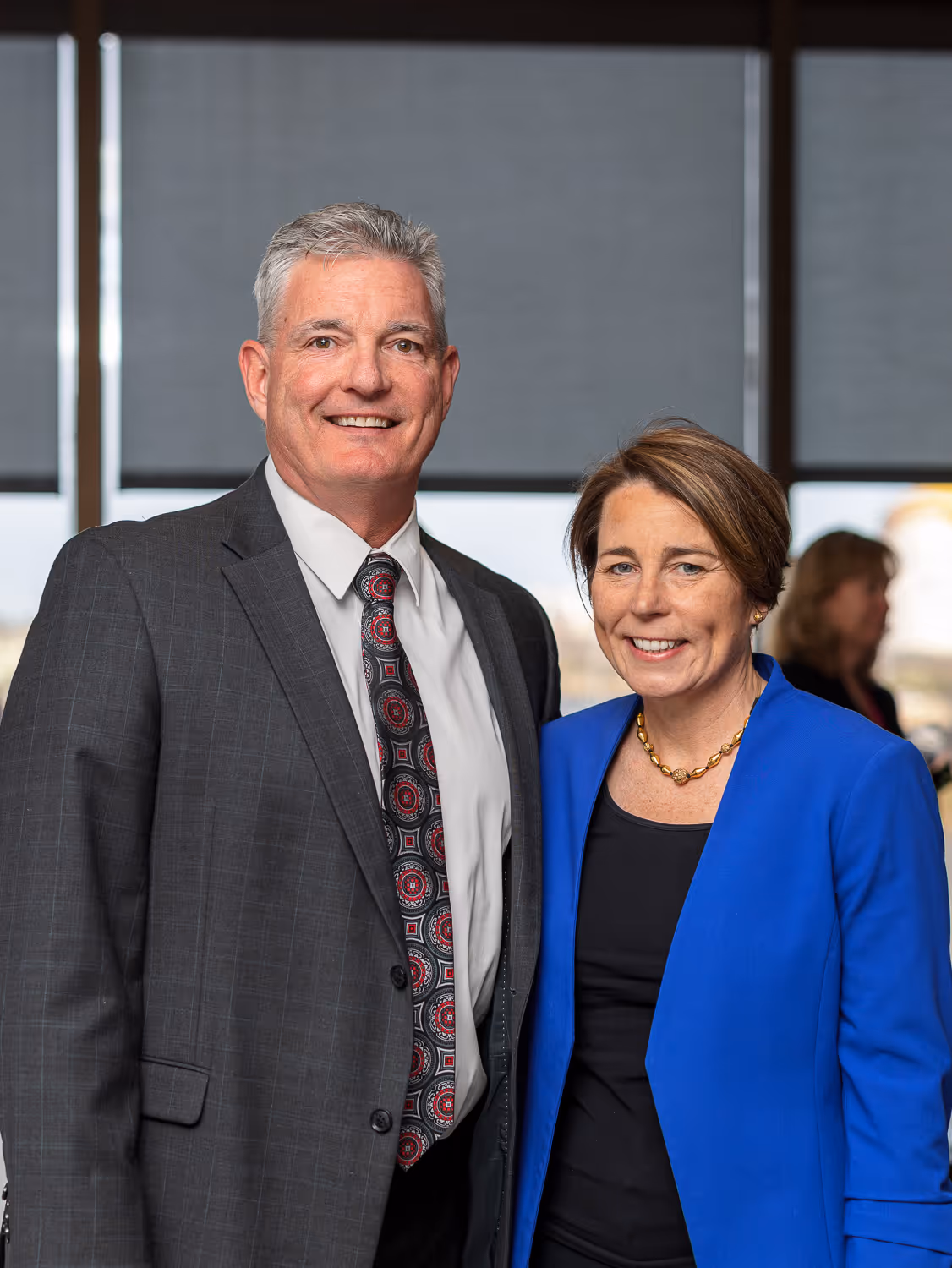 Two business professionals posing at a Boston corporate event captured by Boston event photographer.