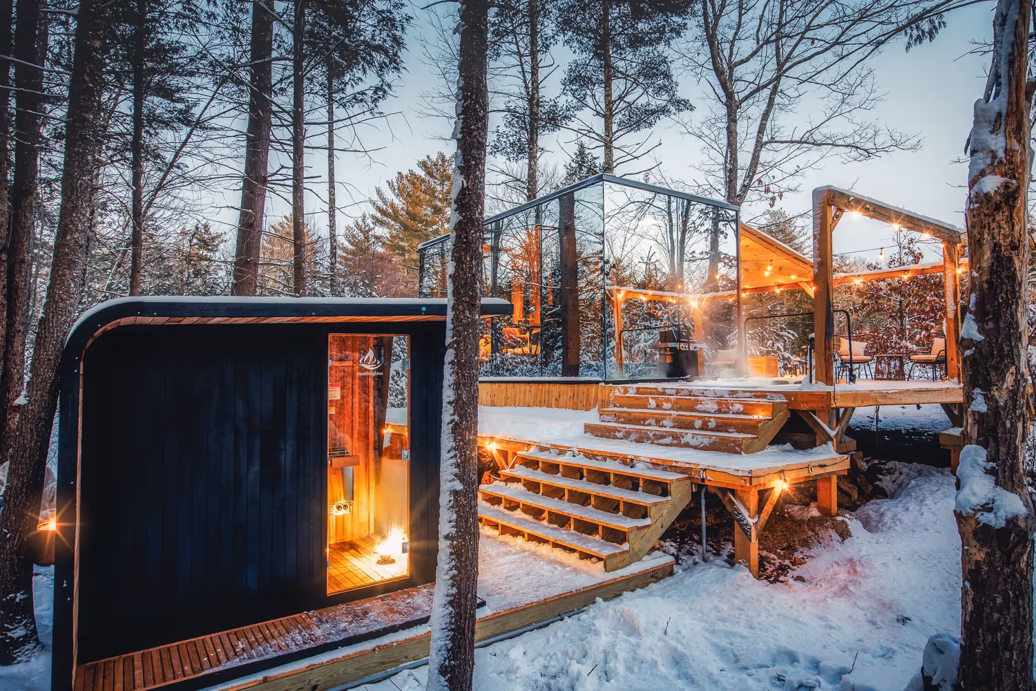Modern glass cabin exterior in snow — Airbnb photographer Maine