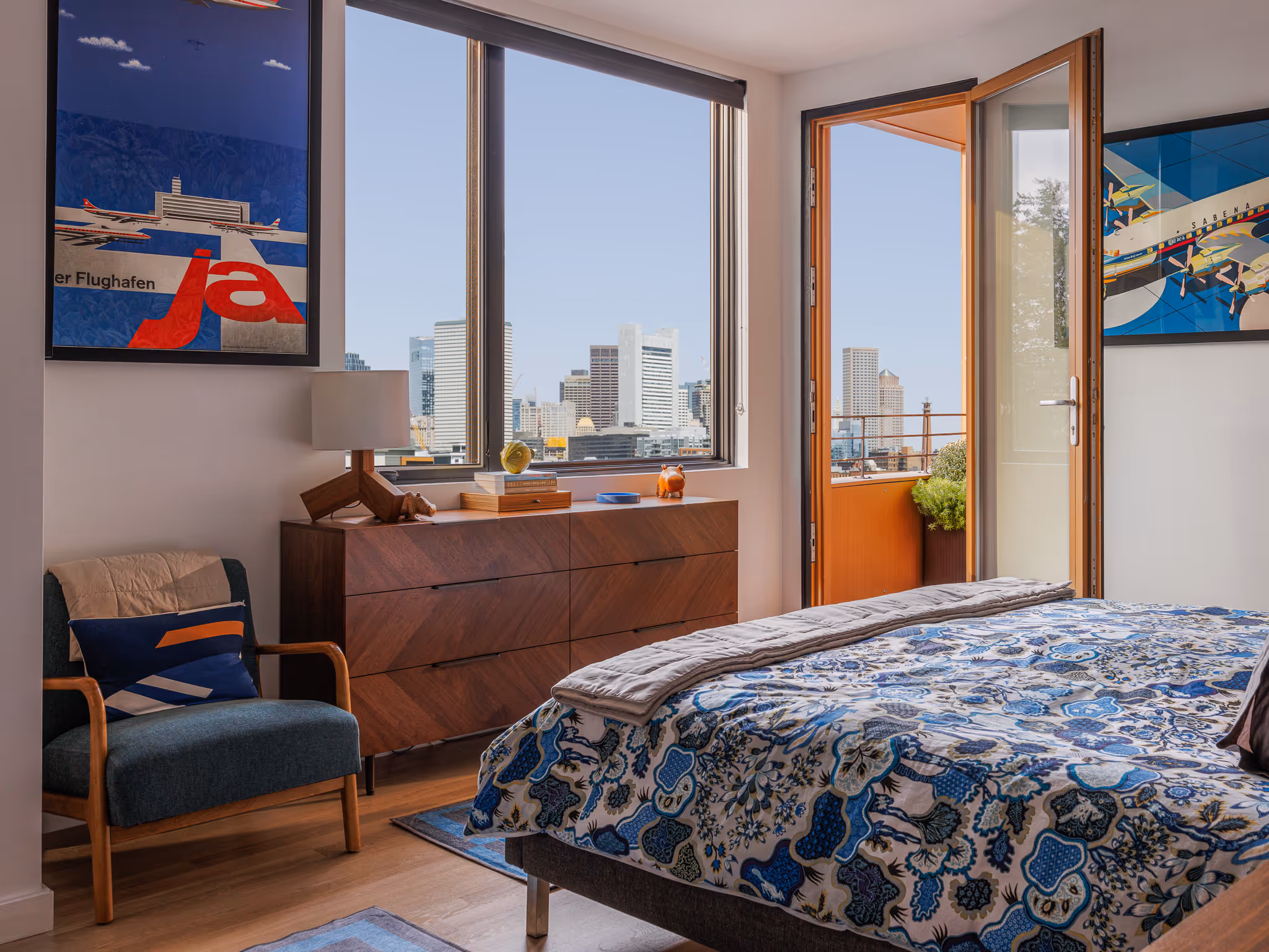 City apartment bedroom with skyline view — Boston short-term rental photographer