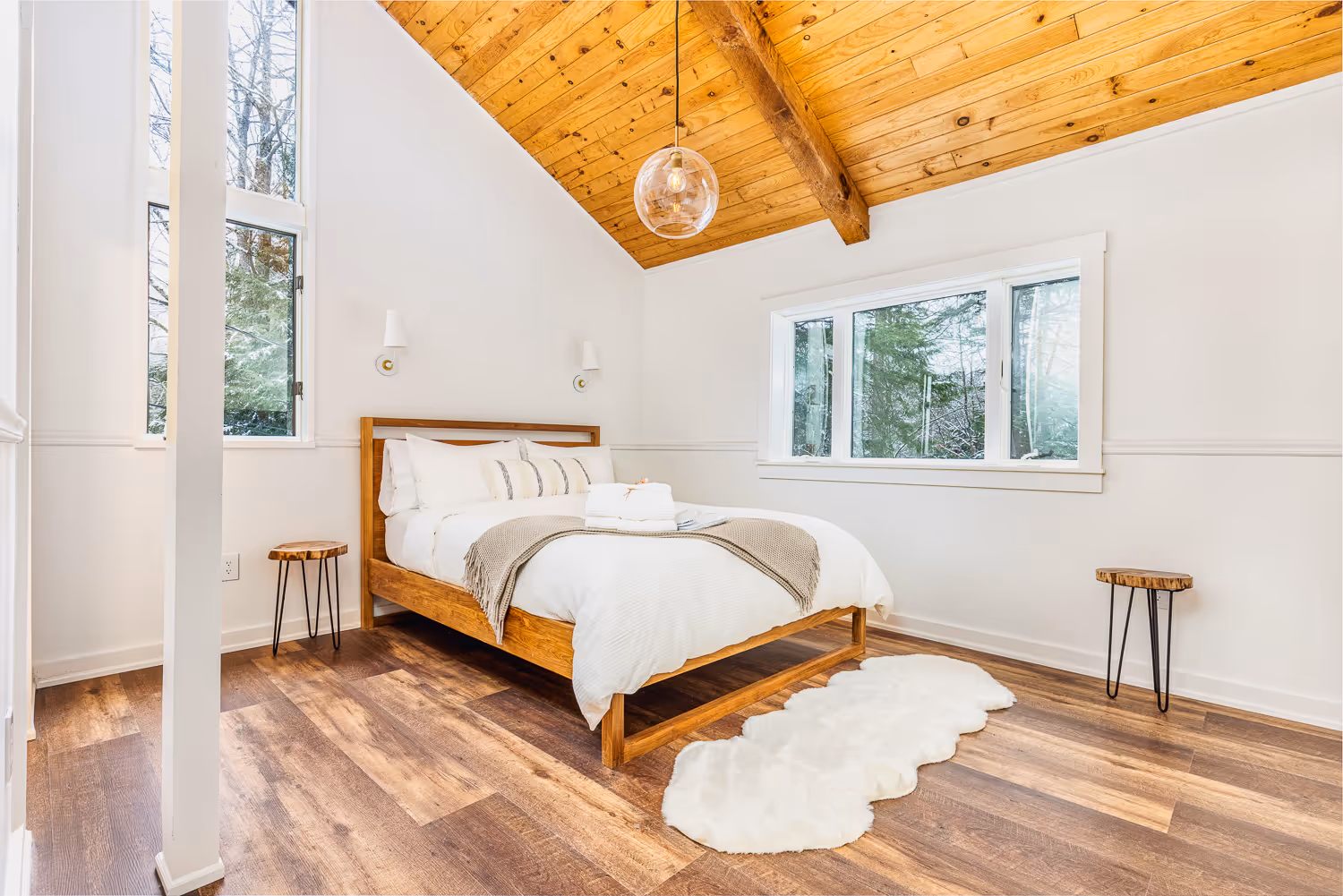 Scandinavian-style bedroom with wood beams — Airbnb photographer Vermont