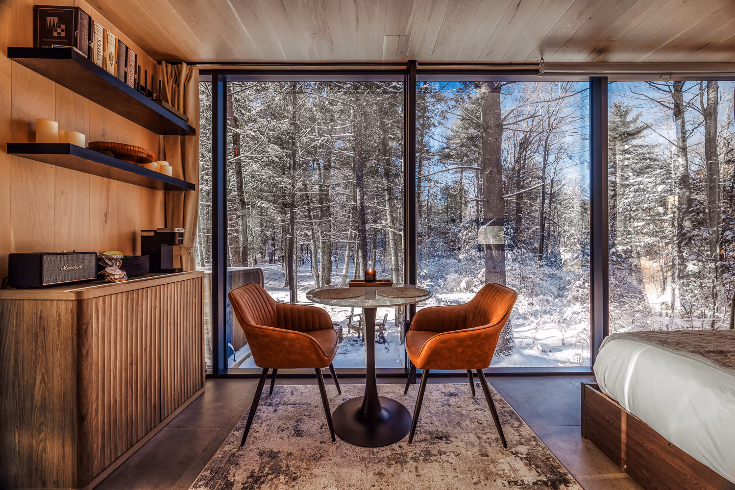 Wood cabin dining area with winter view — Airbnb rental photographer Maine