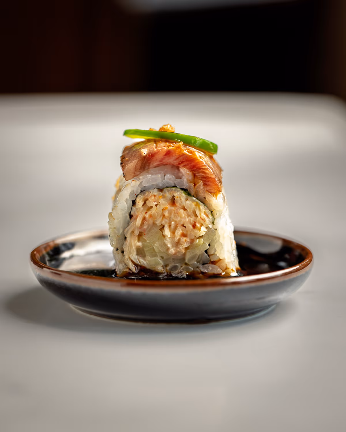 Sushi roll on dark plate