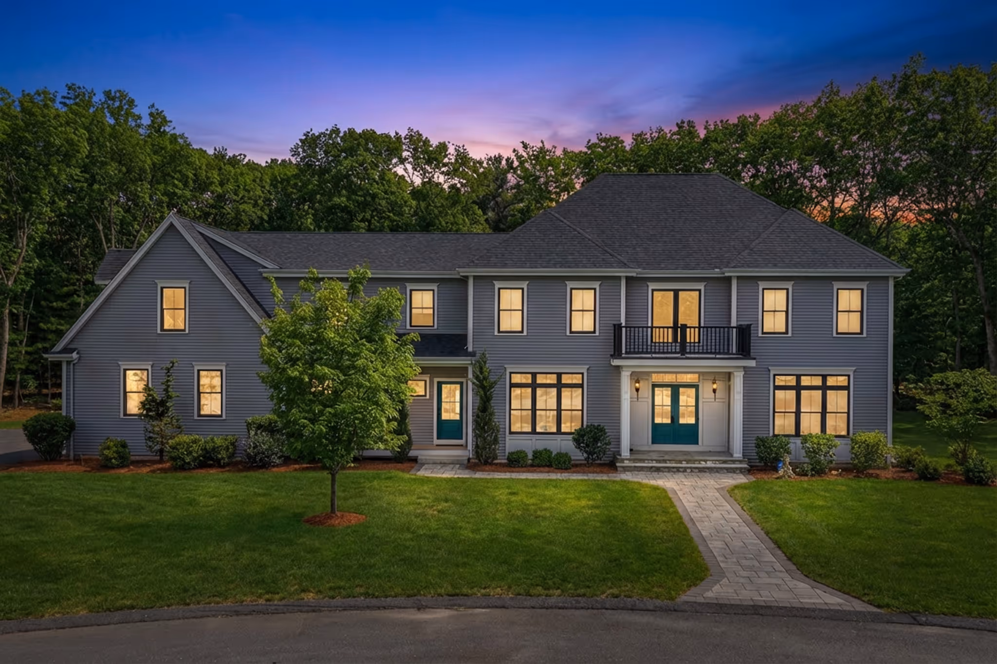 Twilight real estate photography of large colonial home in Plainville MA.