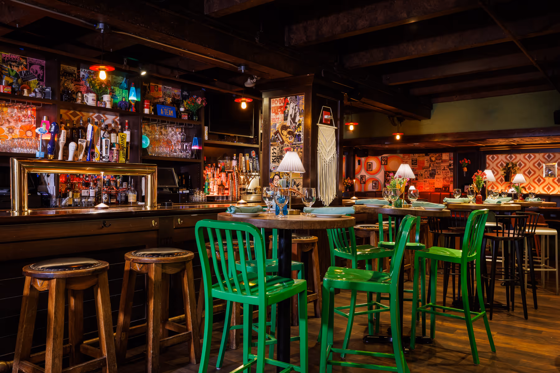 Restaurant bar area at Back Bay Social The Retro Room in Boston MA with high stools and warm accent lighting