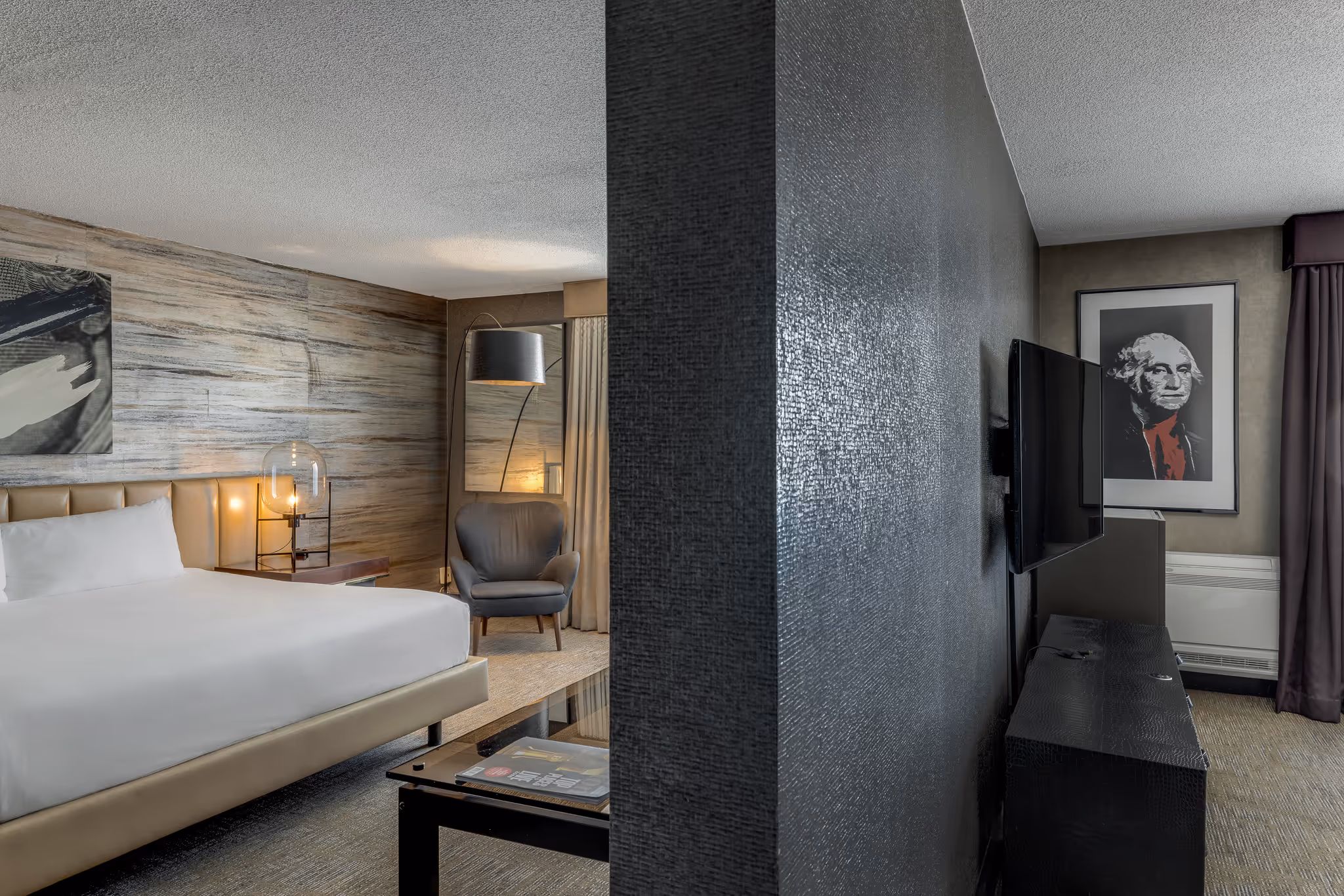 Hotel room view with bed and partition wall in Boston guest room